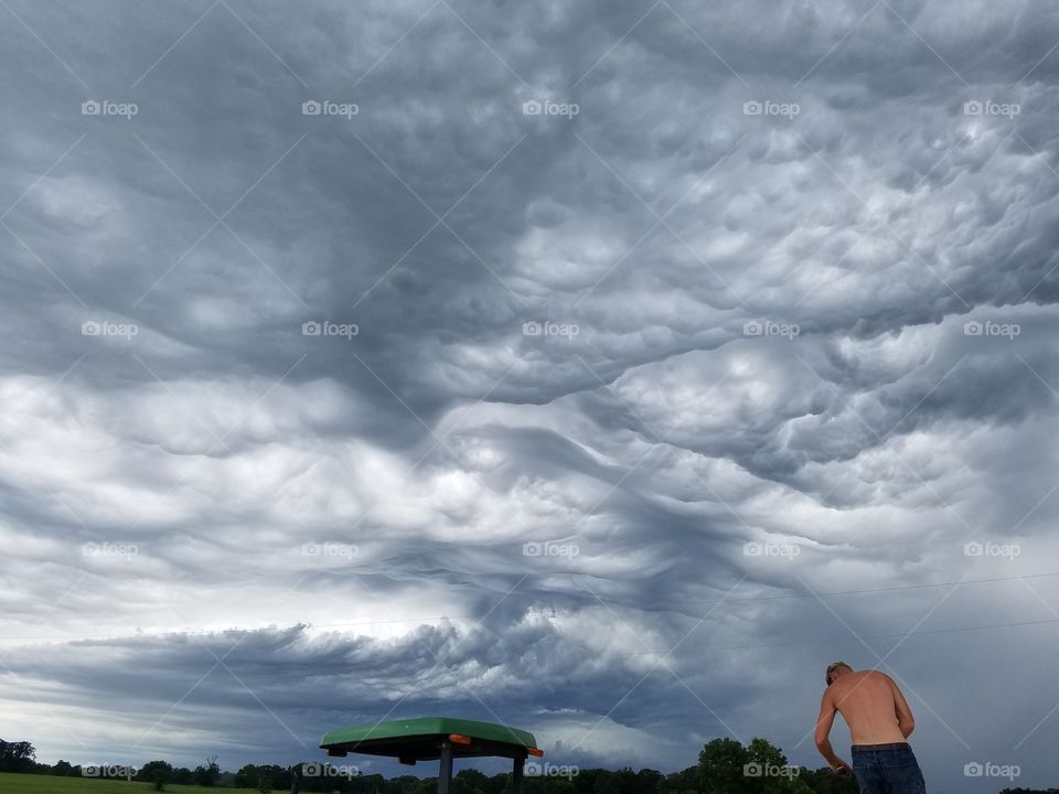 working while storm moves in.