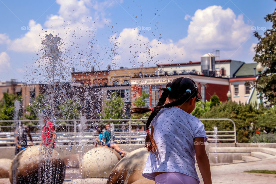 Having fun in a splash pad