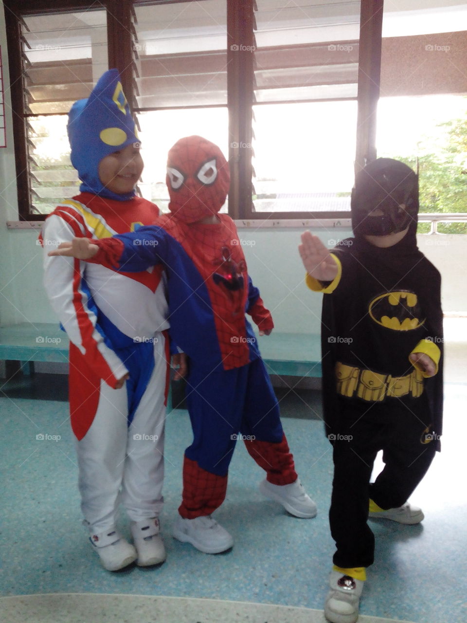 kids disguised as super heroes. Thitiwin an friend at school