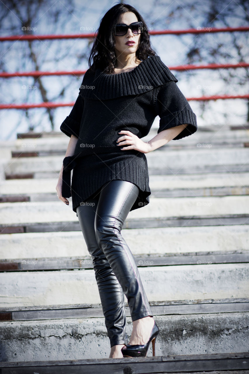 Portrait of a beautiful woman standing on staircase