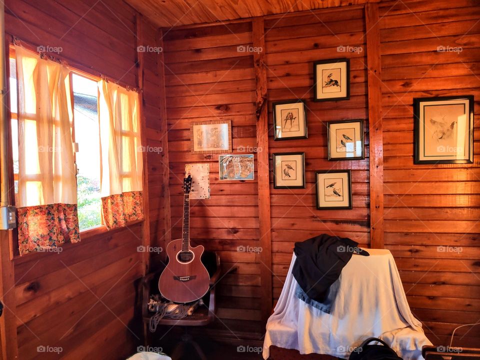 Guitar in wooden hut