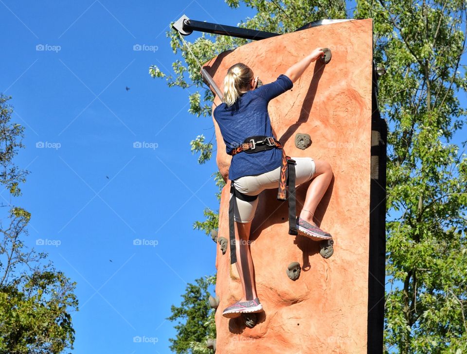 Climbing the rock wall