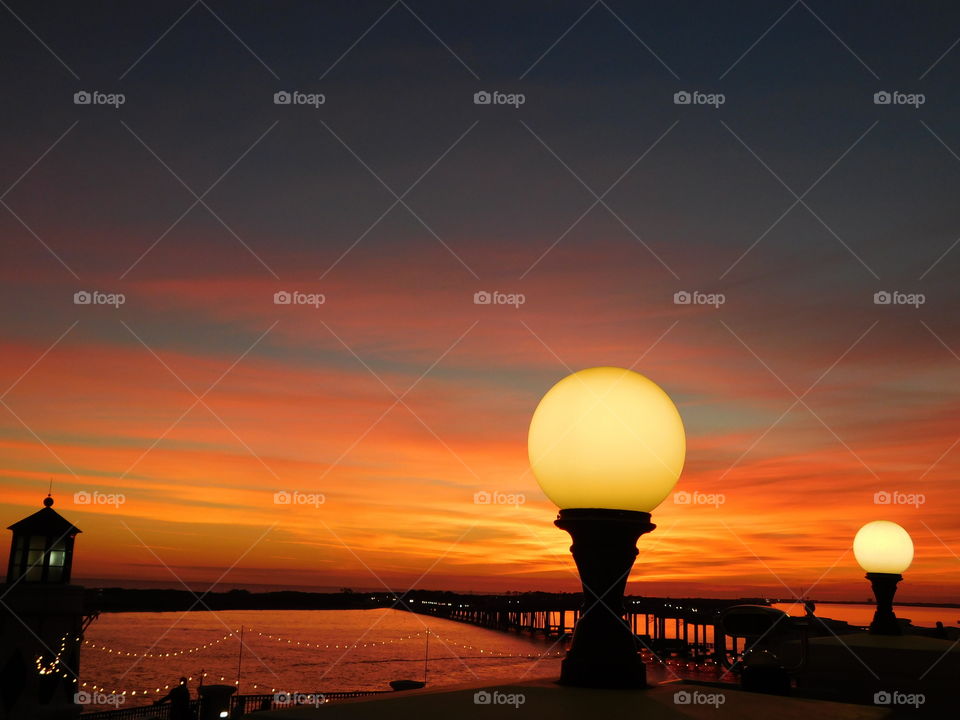 Silhouette of pier over sea