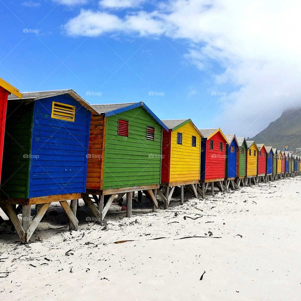 south Africa houses colored beaches red blue yellow green sand