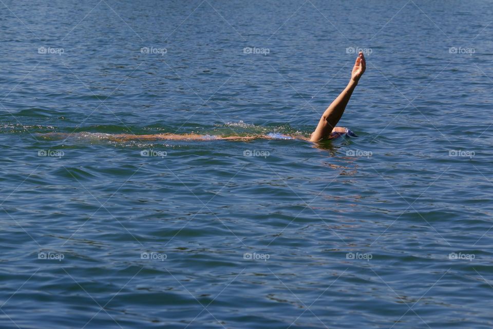 Woman Swimming In Lake