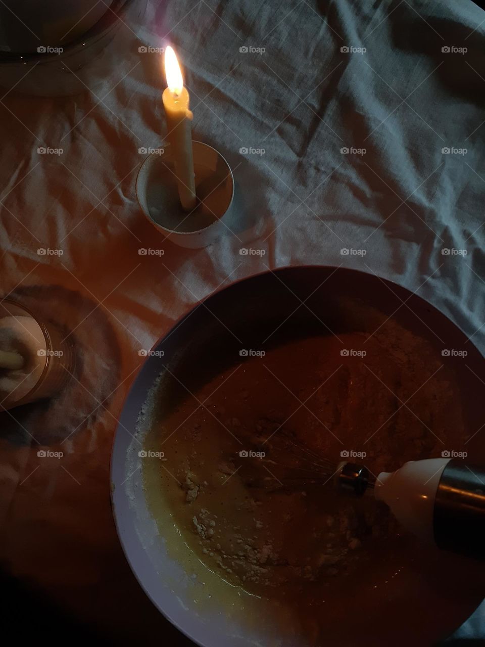 Cooking a sweet biscuit by candlelight