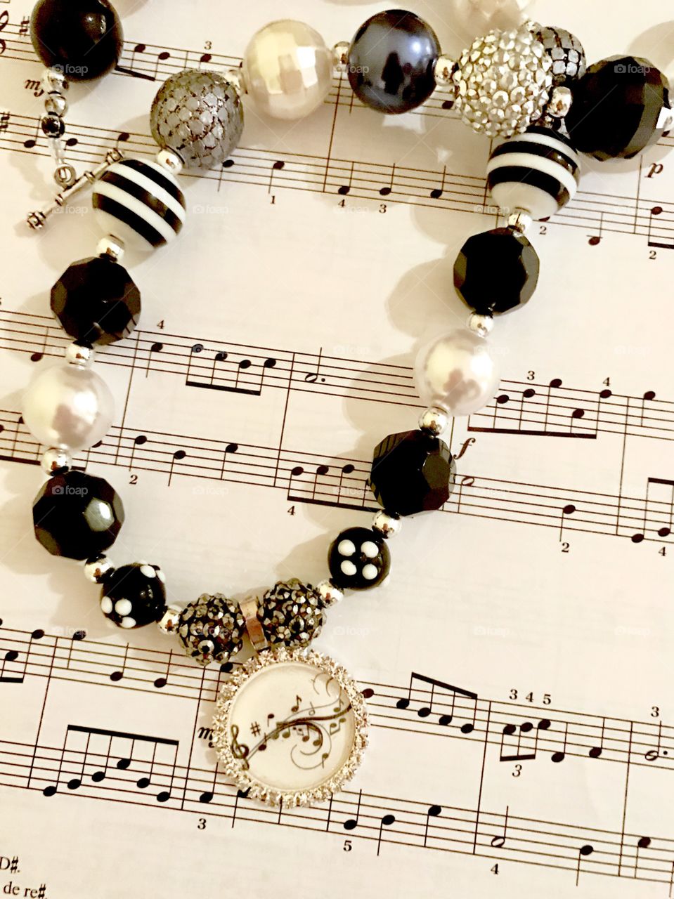 Necklace on Sheet Music
