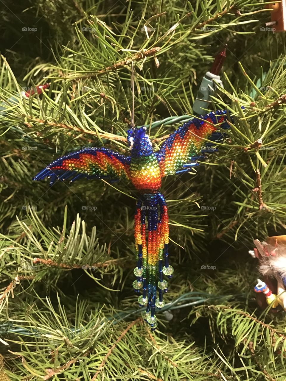 Peacock hummingbird beaded Christmas ornament 