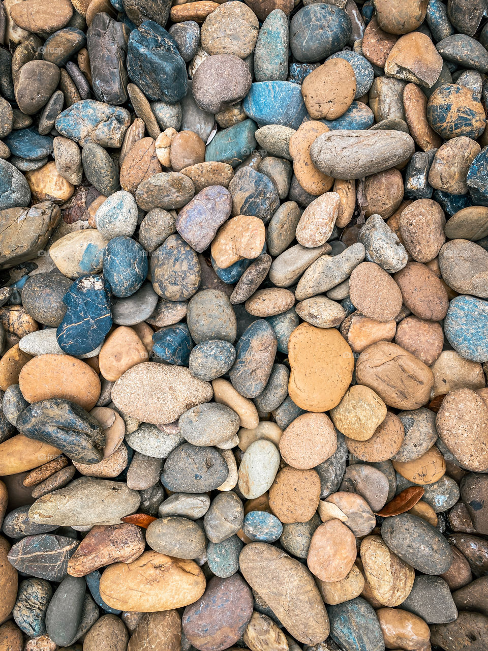 Texture pattern of pebbles gravel and small stones in walk way path for garden interior decoration