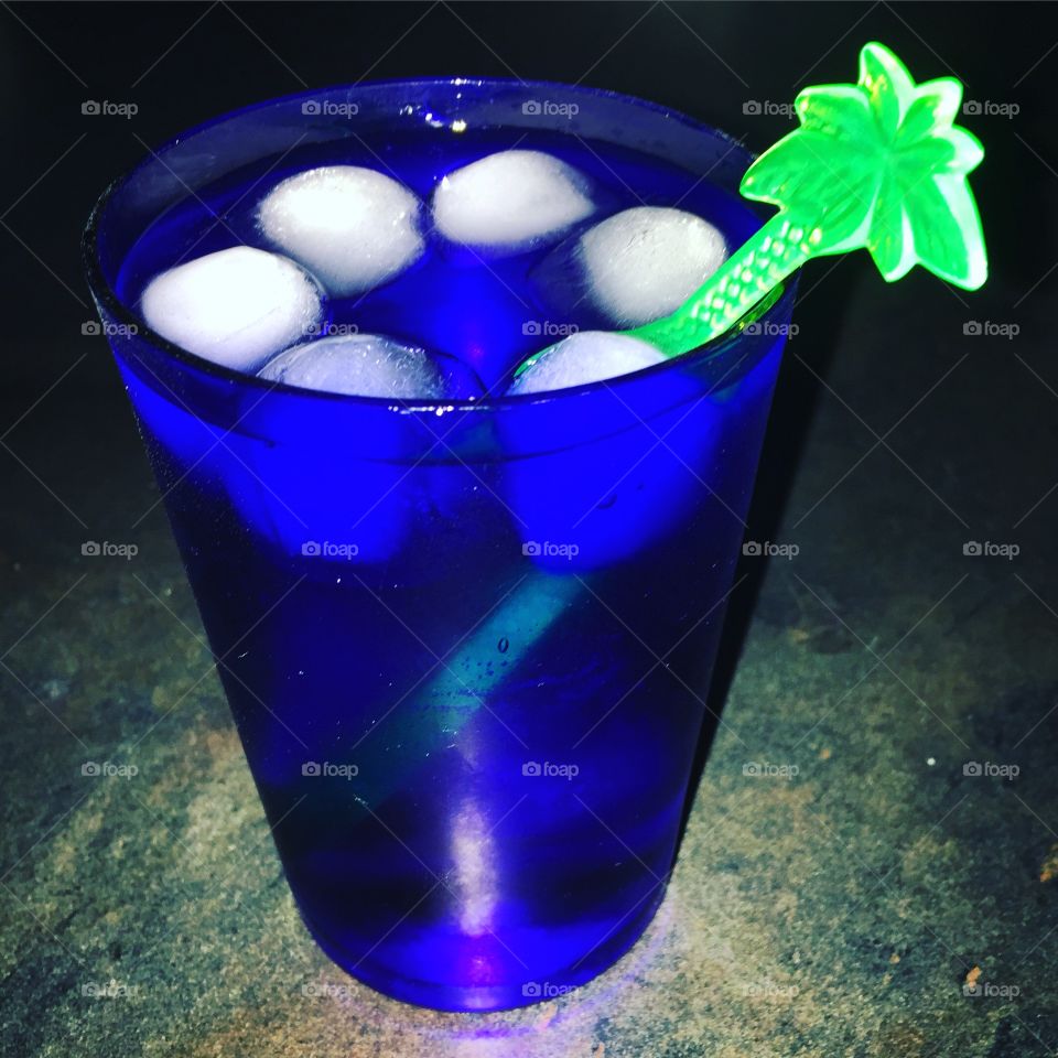Cocktail in cobalt blue glass