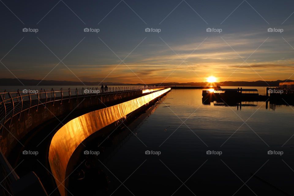 Sunset enlightenment on breakwater