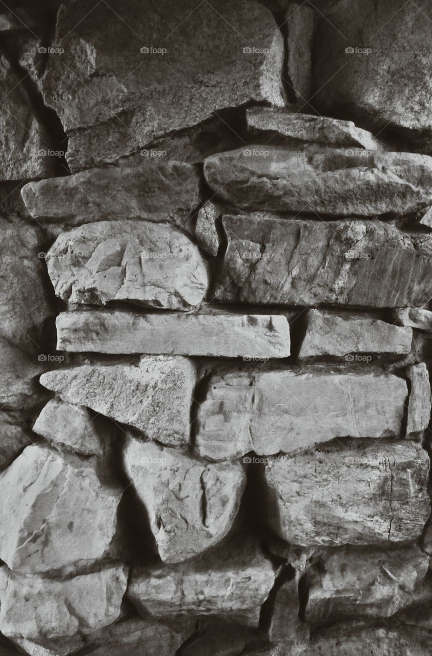 Stone wall. Black and white wall of stone