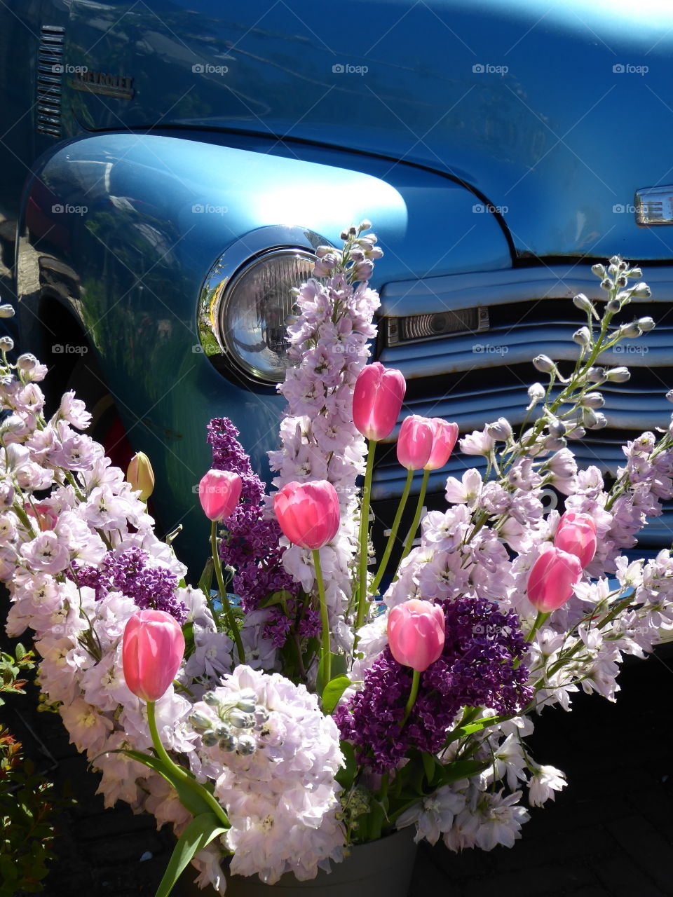 flower arrangement in front of a car