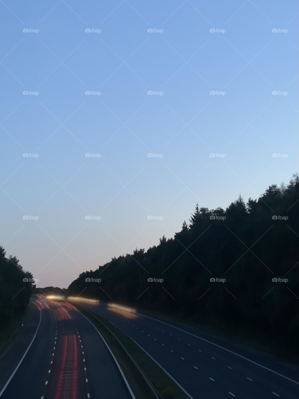 Exposure edit on moving traffic. Photographed on iPhone camera on a summer evening. 