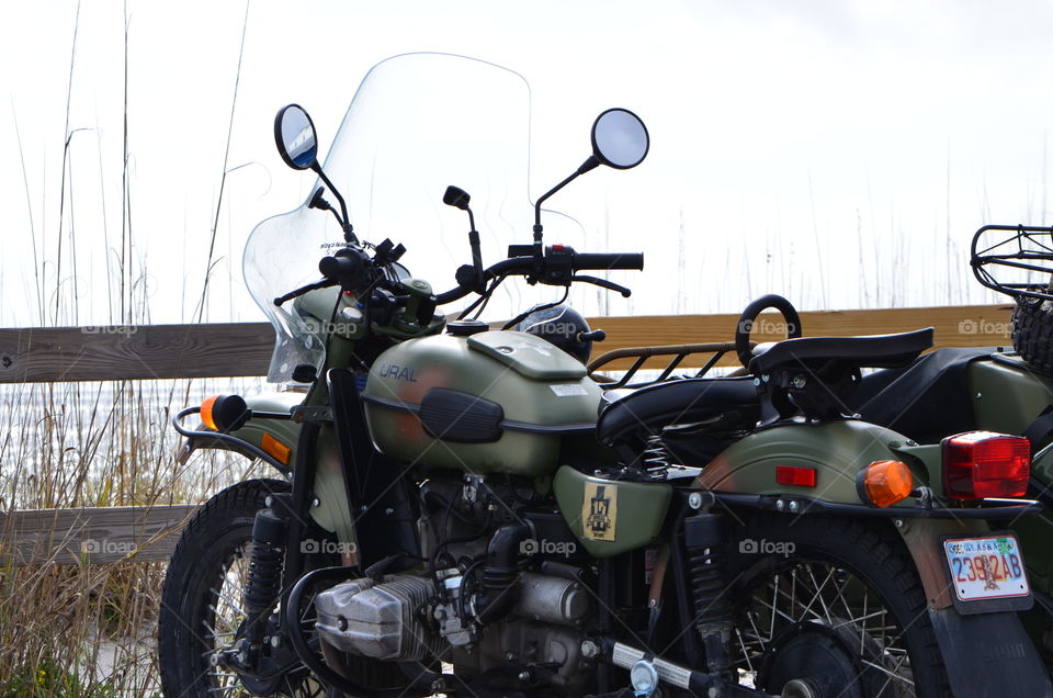 motorcycle World War II vintage style with Sidecar and olive drab paint job