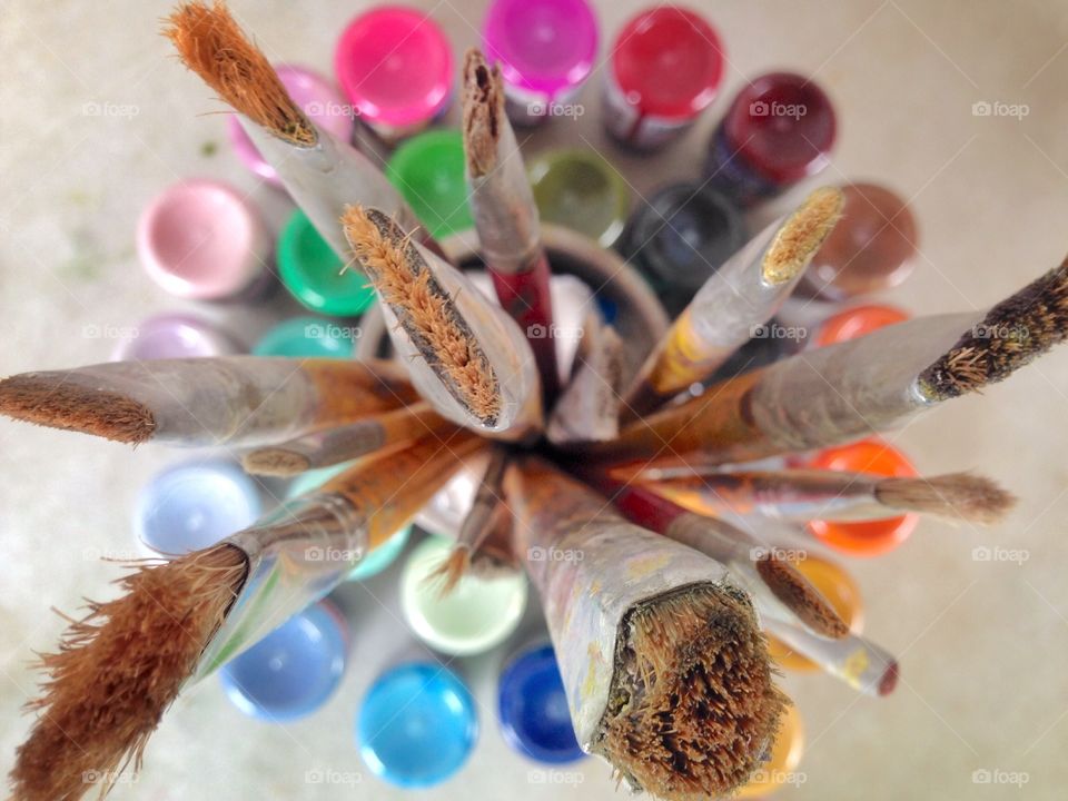 Paintbrushes and color bottles