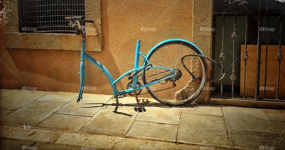 Plundered bike. Beautiful moment in the street of La Barceloneta, Barcelona.