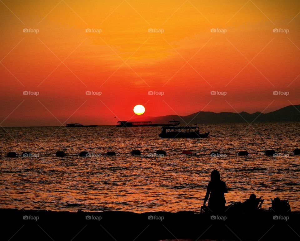 Dramatic orange sky during the sunset upon the sea