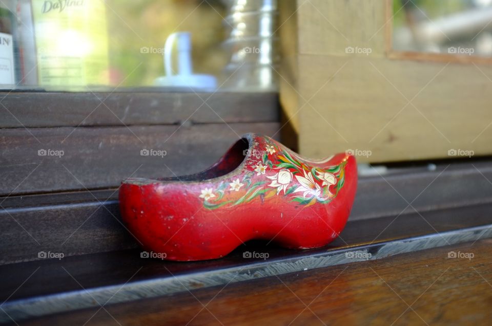Red shoes made of wood.