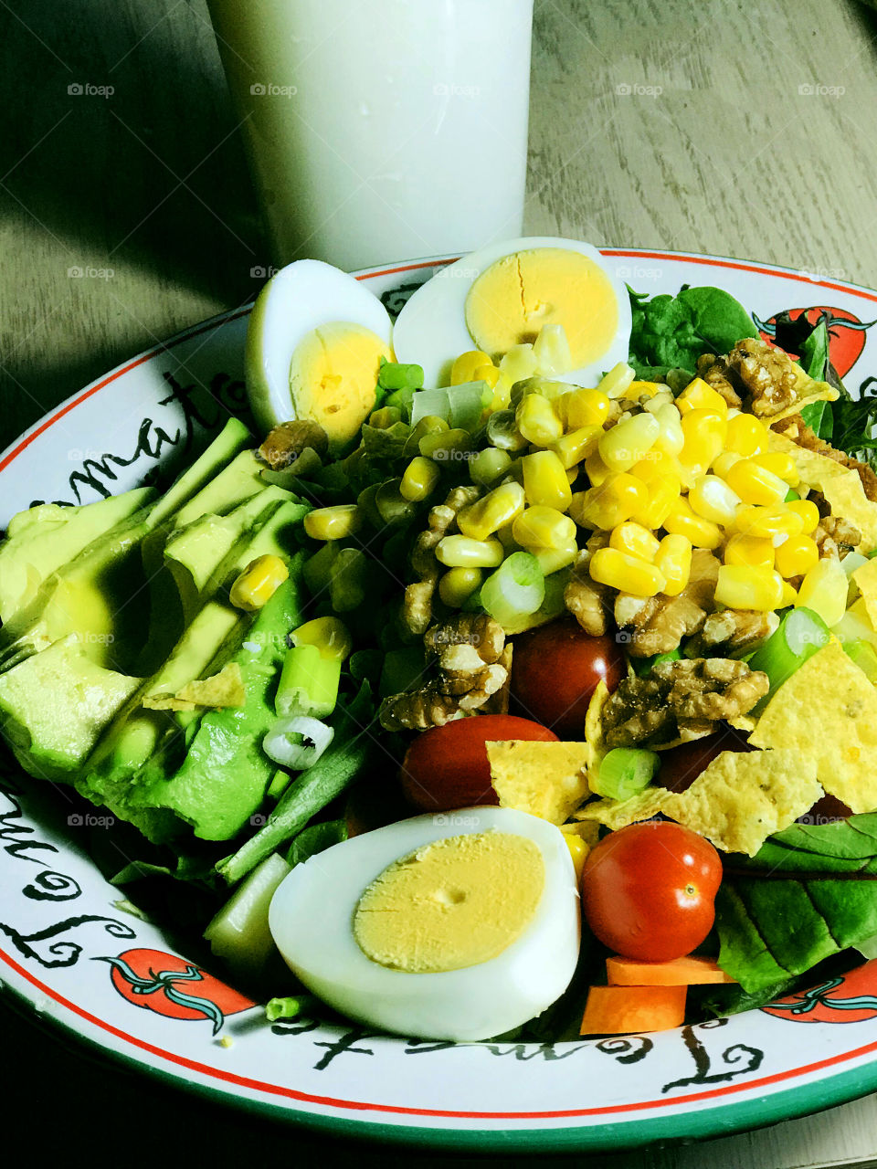 My version of a Cobb salad; mixed greens, leftover Easter eggs, corn, avocado, chicken, grape tomatoes, sliced carrots, green onions, walnuts, crumbled corn chips.  And a glass of milk. Yum! 