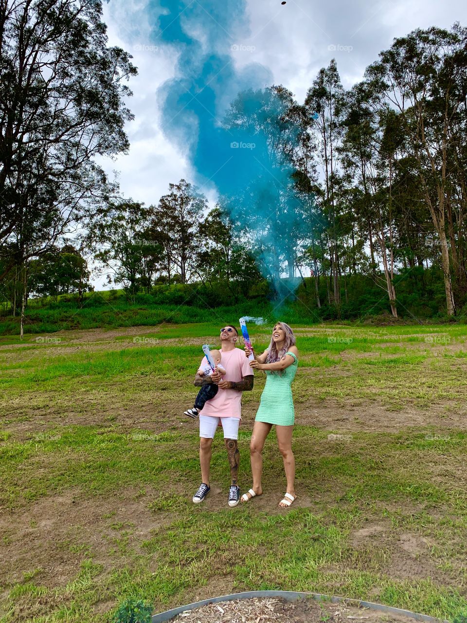 Couple with their first born child, at their 2nd gender reveal finding out that their second baby is going to be a boy! The excitement and surprise looks on their faces are awesome to see! They are going to be a wonderful family. 