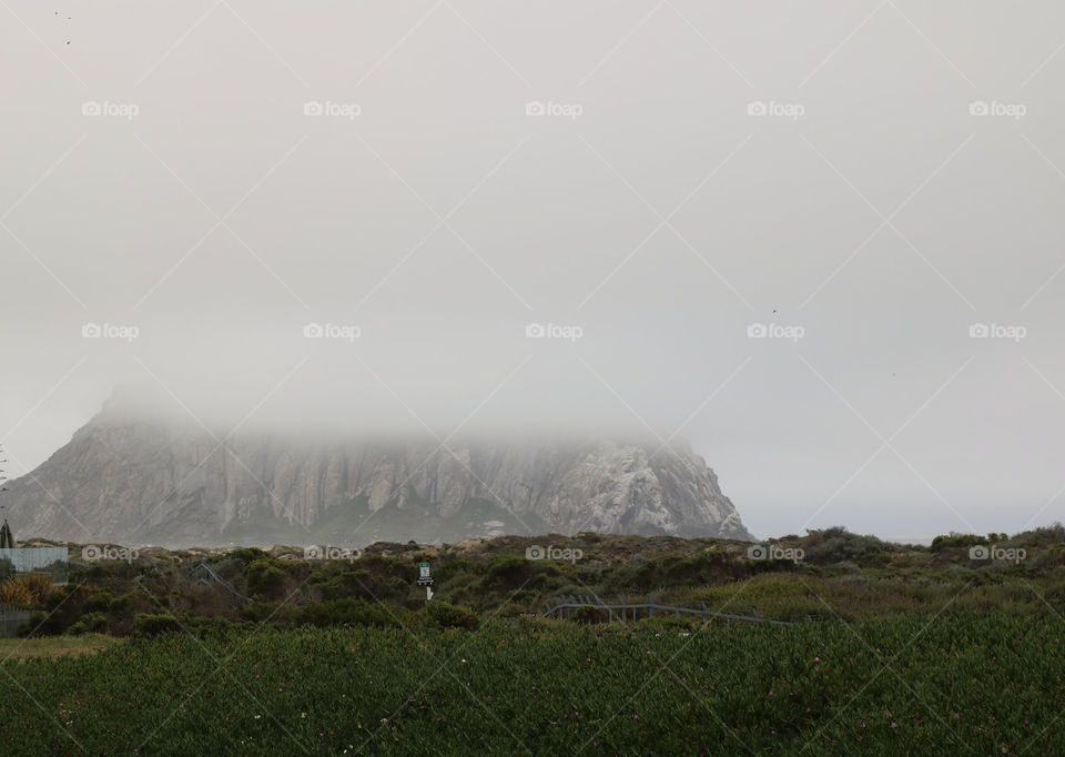 Extinct Volcano Morro Rock in fog