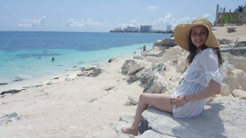 Happy girl on beautiful beach in Cancun, Quintana Roo Mexico.