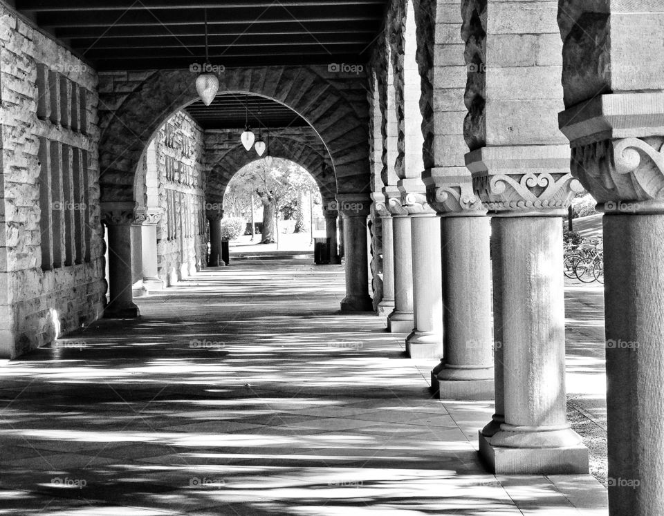 Black And White Architecture. Light And Shadows In A Columned Hallway
