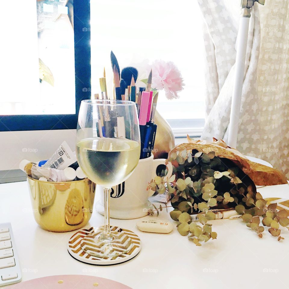 Wine glass on pretty desk