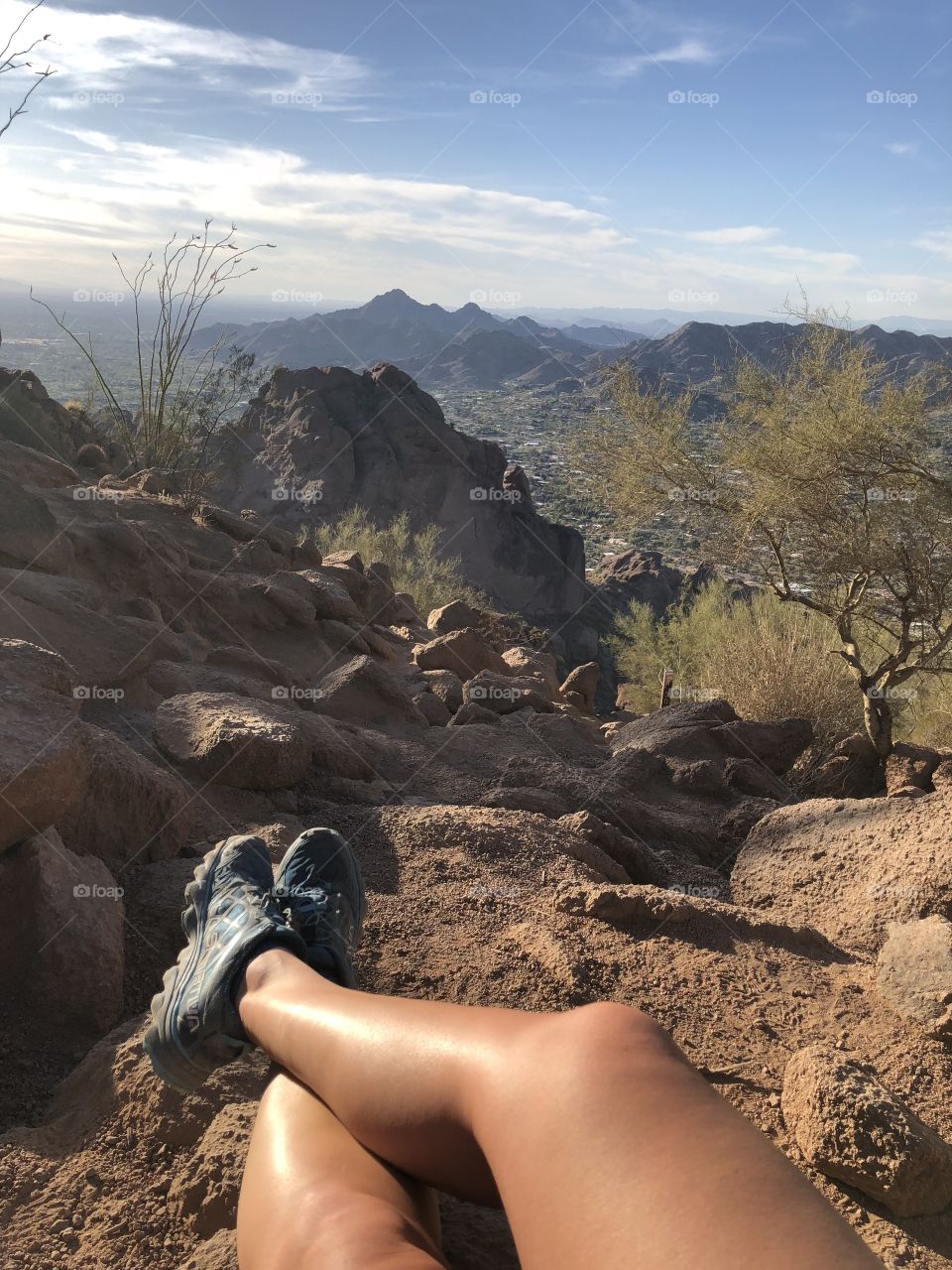 View of the desert while sitting on top of a mountain trail