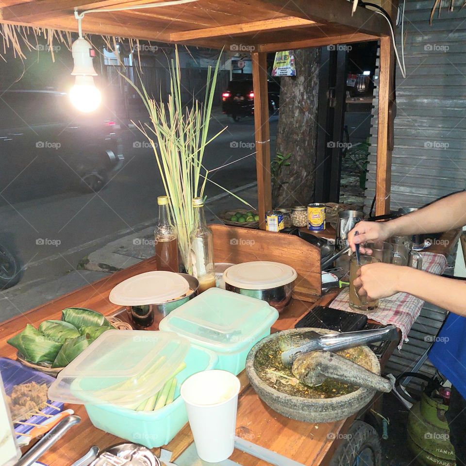 a unique food stall in Indonesia that sells spices and traditional snacks