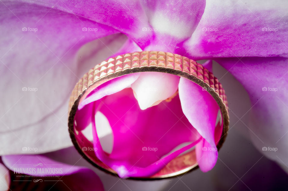 Wedding ring on orchid