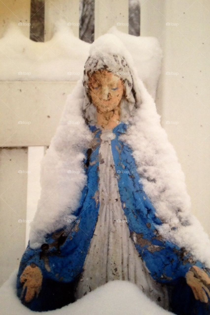 Snow covered statue