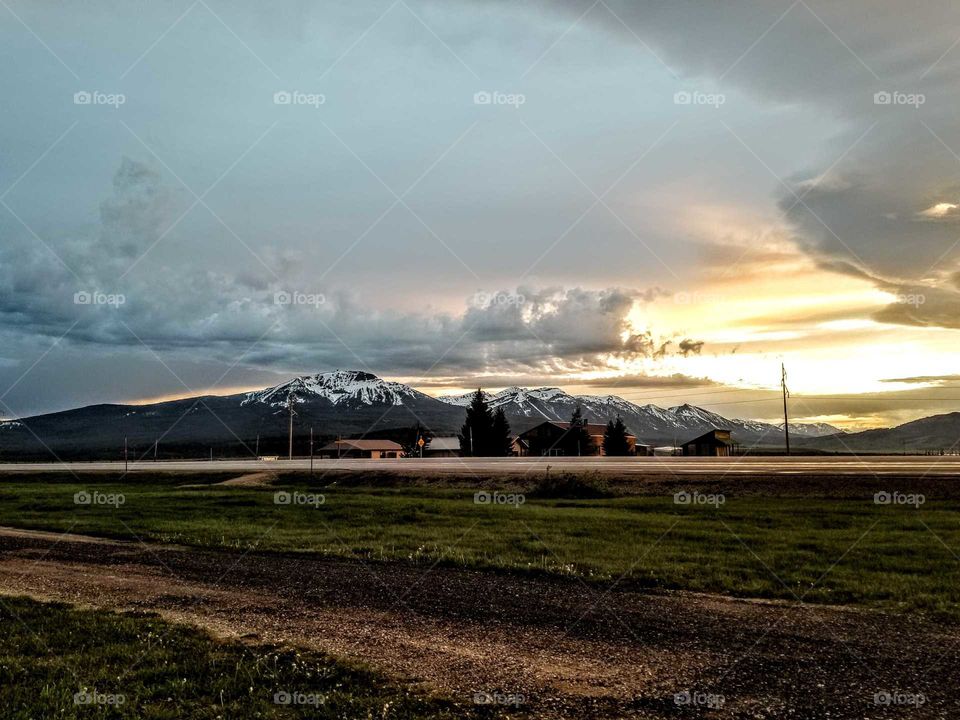 snow caped mountains at sundown
