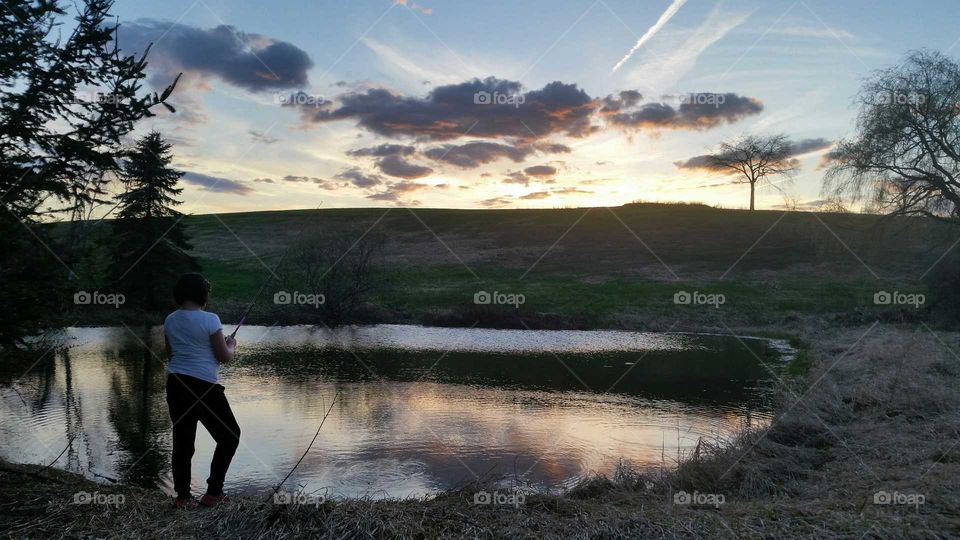 Fishing on Golden Pond. summer's golden glow on the lower 40's pond.