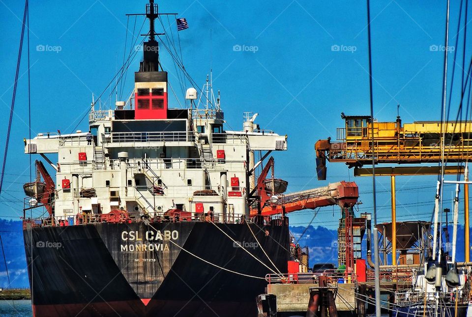 Cargo ship loading at an international shipping port