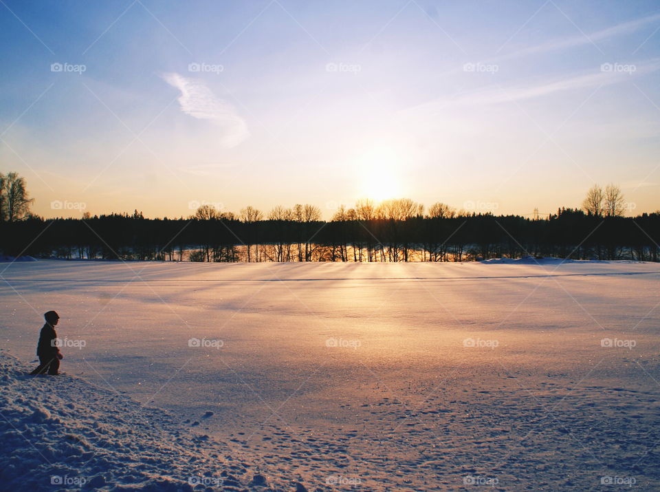 Child and beautiful winter landscape