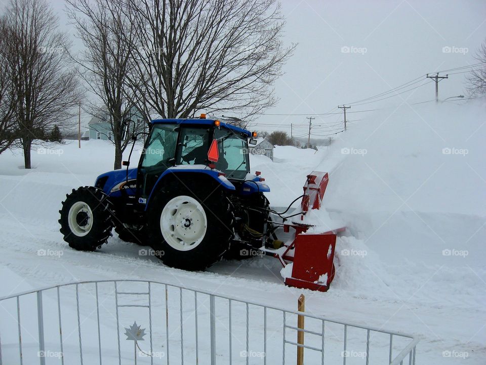 tractor blowing snow