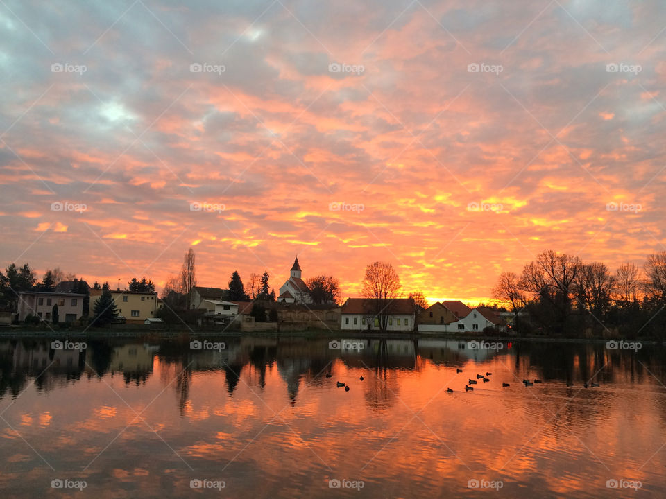 Sunset over the pond in the Czech village Hovorčovice.