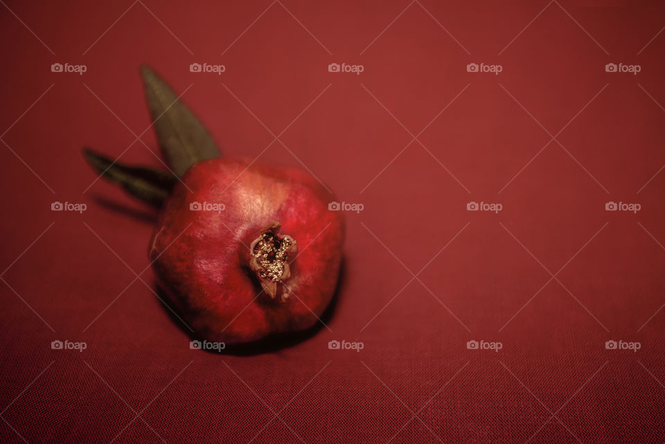 Ripe pomegranate fruits close up. In the background there is a blurred background.