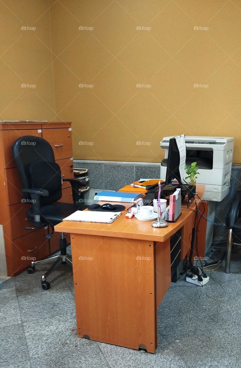 a frame of office desk , chair and a good work day