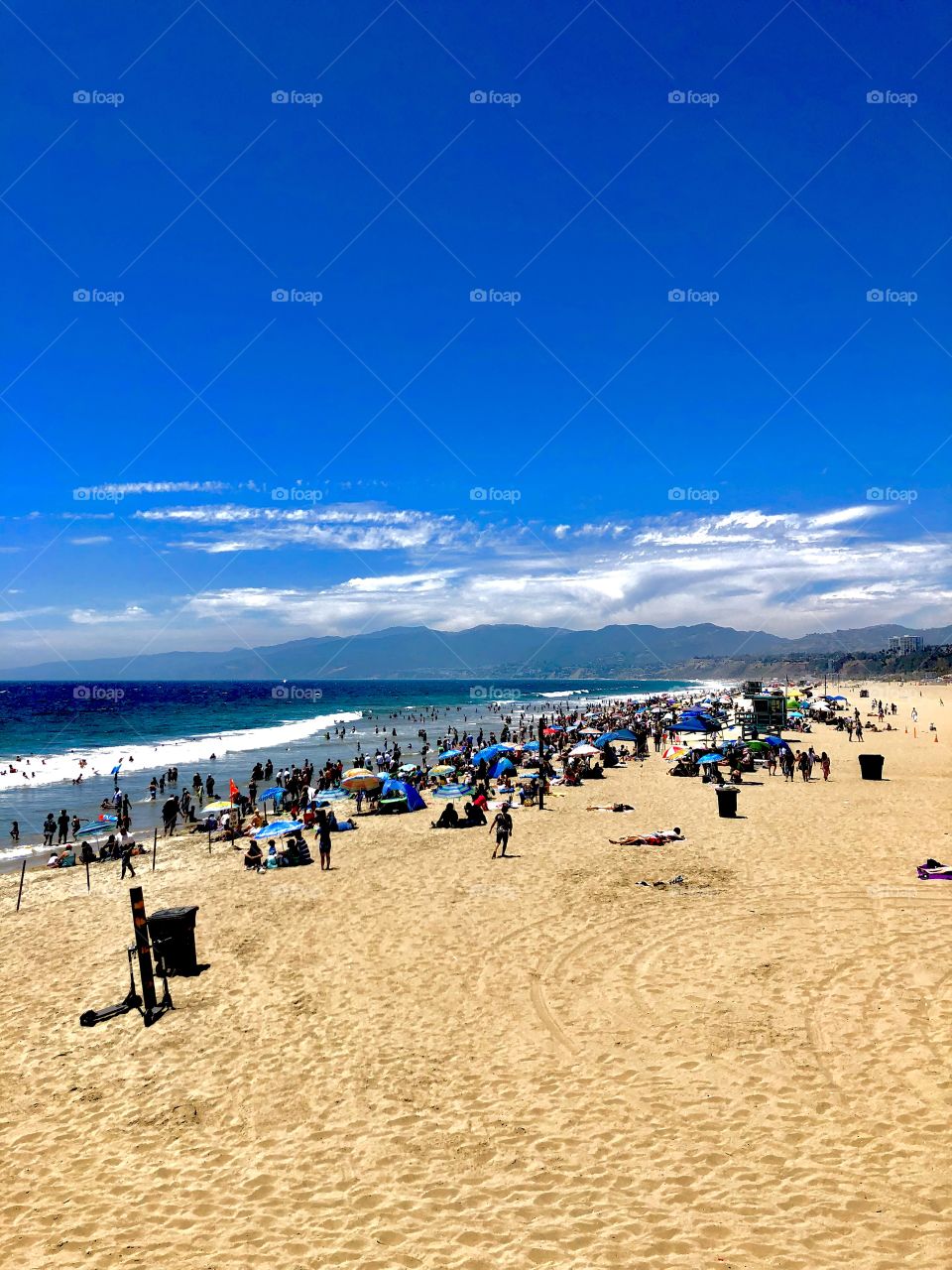 Santa Monica Beach in sunny California. Warm sand and blue waves make the perfect beach day in this vacation getaway