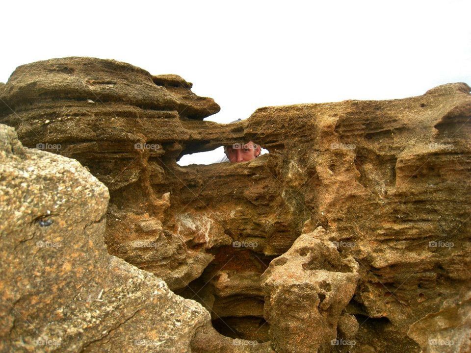 peeking through the rocks