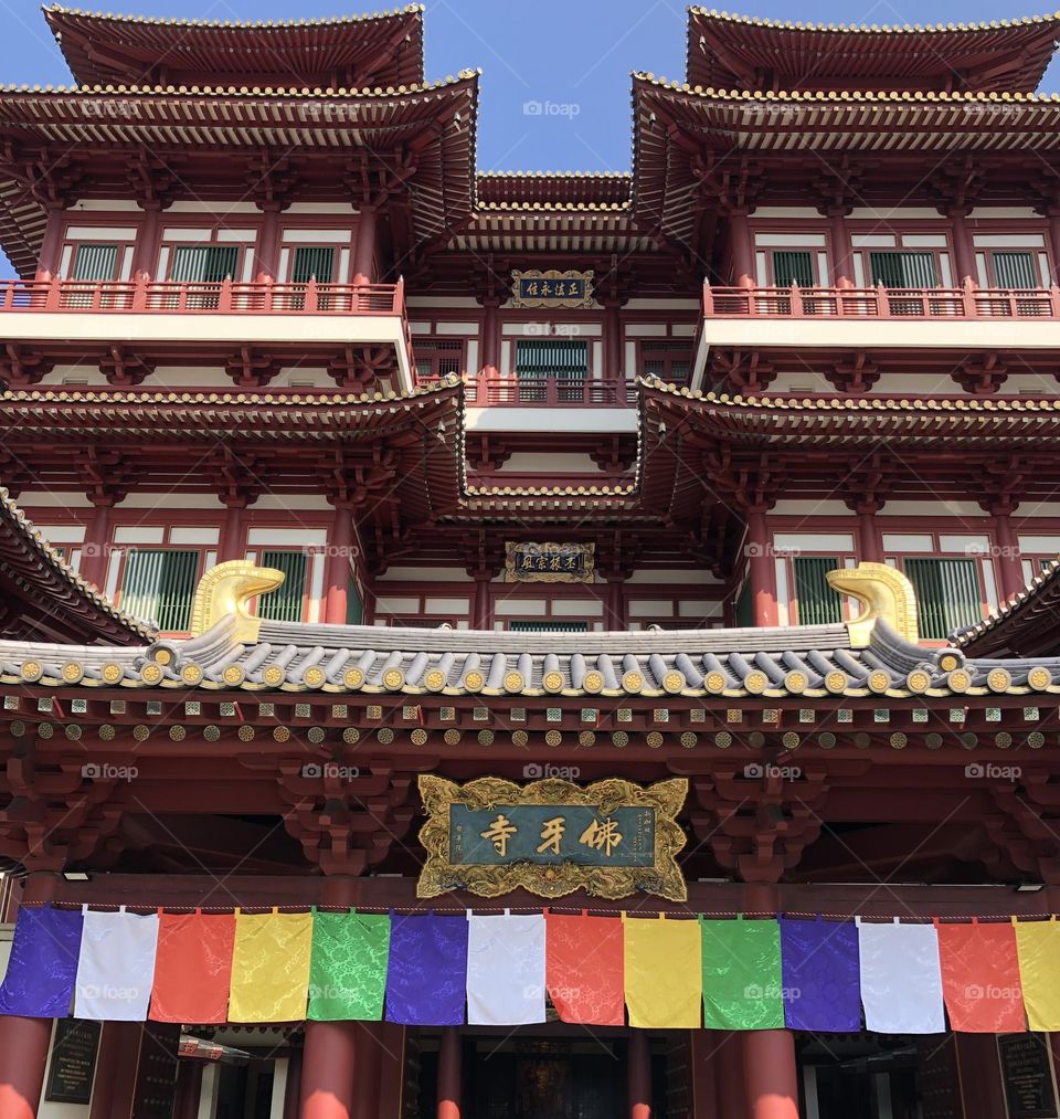 Colored flags at the Buddhist temple entrance 