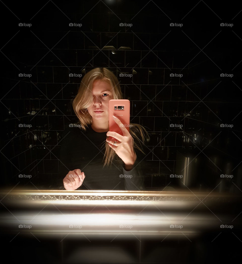 Blonde girl in a mirror