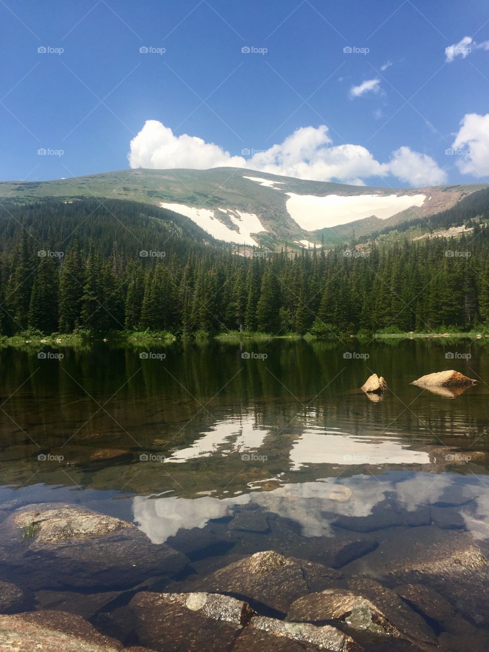 Finding peace in the reflection of Indian Peaks Wilderness