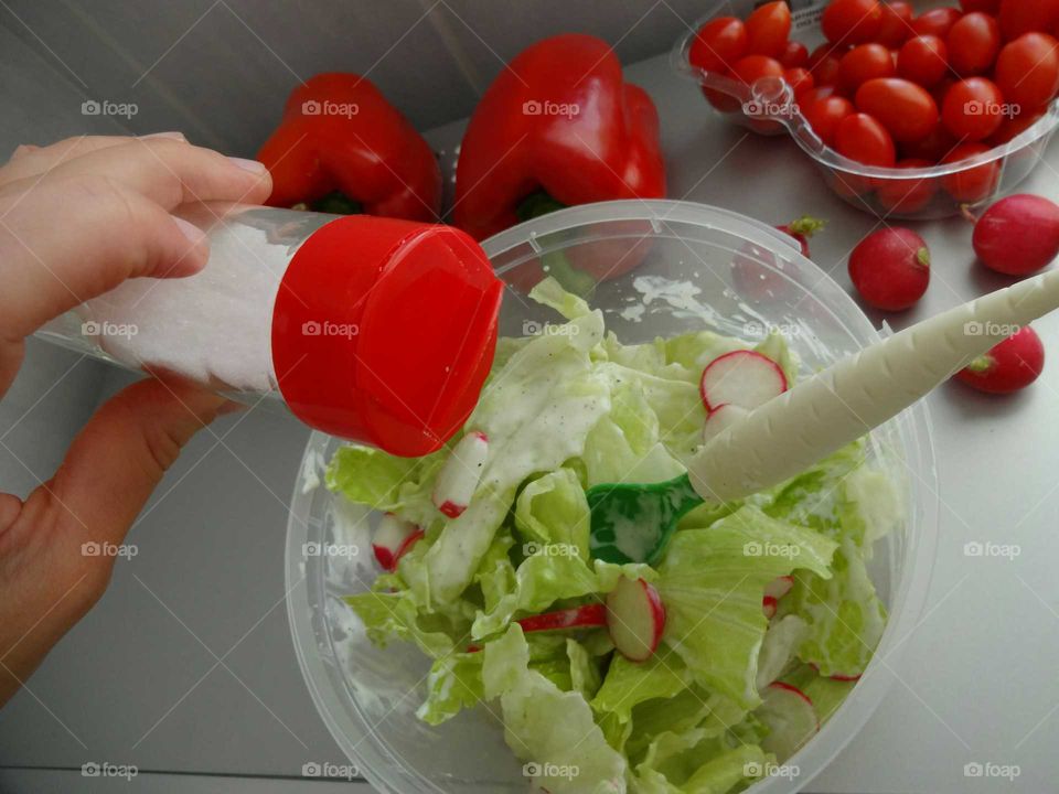 Woman preparing salad