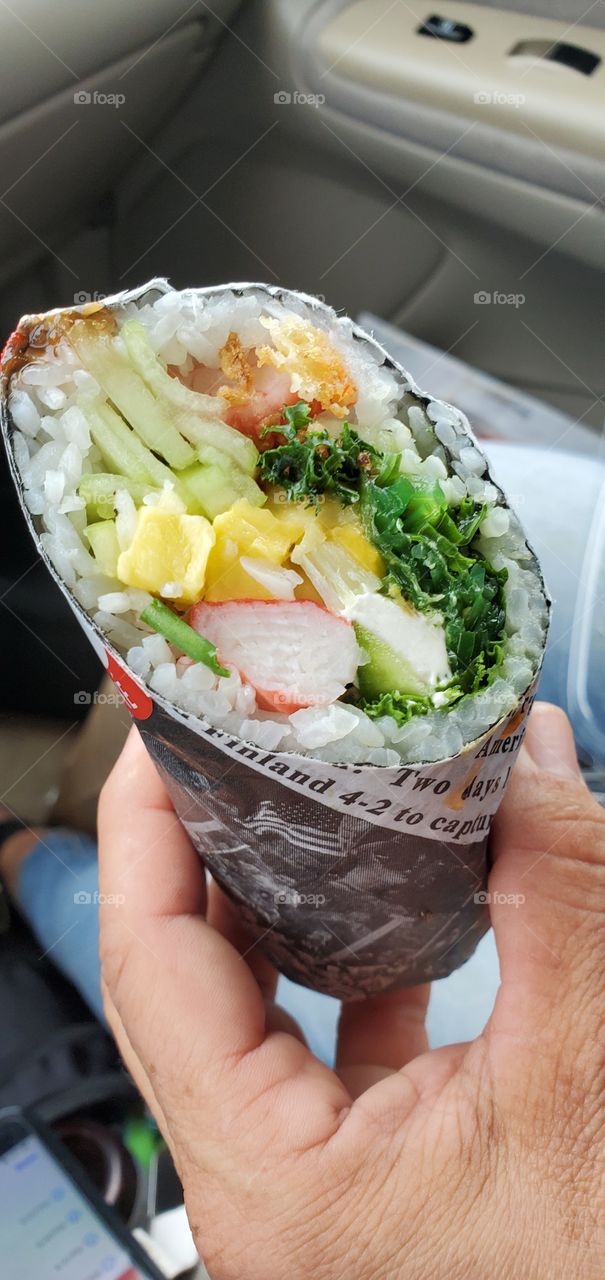 This delicious sushi burrito is courtesy of Hula Poke!