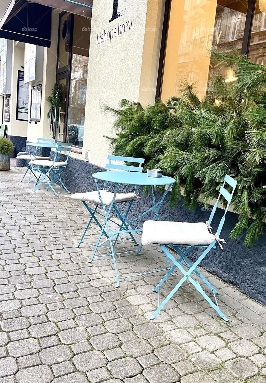 Blue table with chairs in a street cafe