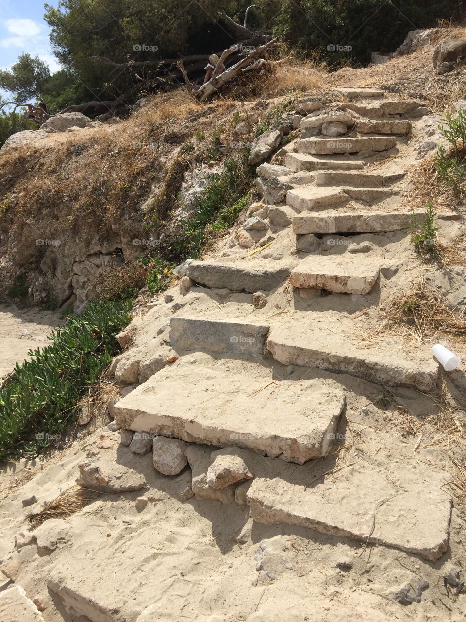 Steps up to the cliffs at Illetas Beach